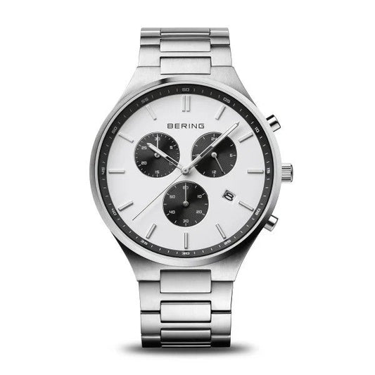 The Bering Watch - Titanium Chronograph Mens Silver (11743-704) features a white dial with three black subdials, date window, silver hour markers and hands, stainless steel link band, plus two buttons and a crown on the right.