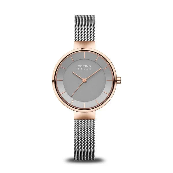 The Bering Watch - Solar Collection - 14631-369 features a round silver-gray dial, rose gold stainless steel case, thin hour markers, and a silver mesh band, all by Bering and displayed on a white background.