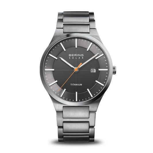 The Bering Watch - Solar Titanium Collection (15239-779) is a sleek men’s watch with a titanium case, gray dial, silver markers and hands, orange second hand, date at 3 o’clock, and a brushed silver titanium band.
