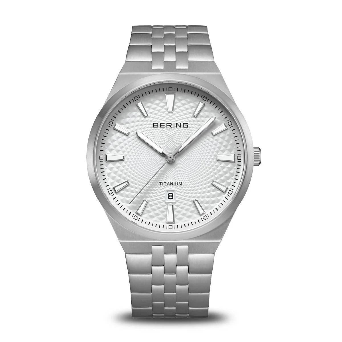 The Bering Watch - Limited Edition Titanium (16141-704) features a silver case, textured white dial, minimalist hour markers, date window at 6 o’clock, and metal link band—blending modern elegance with titanium strength.