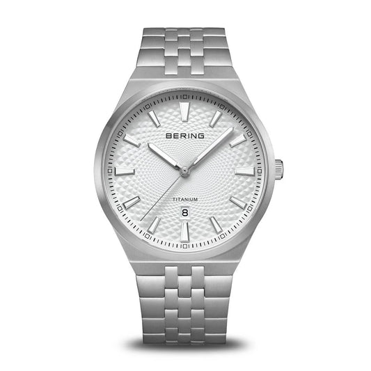 The Bering Watch - Limited Edition Titanium (16141-704) features a silver case, textured white dial, minimalist hour markers, date window at 6 o’clock, and metal link band—blending modern elegance with titanium strength.