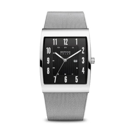 The Bering Watch Mens Slim Solar Collection 16433-002 features a rectangular black dial with silver markers, a date window, and a silver mesh band. This eco-friendly watch offers a minimalist, modern design by Bering.