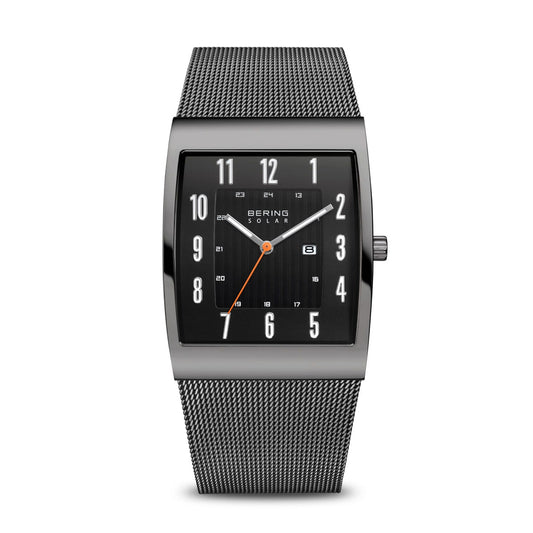 The Bering Watch - Slim Solar - 16433-377 features a rectangular black dial with white numerals, orange second hand, date display, and a stainless steel mesh band. The slim face bears “BERING SOLAR.” Brand: Bering.