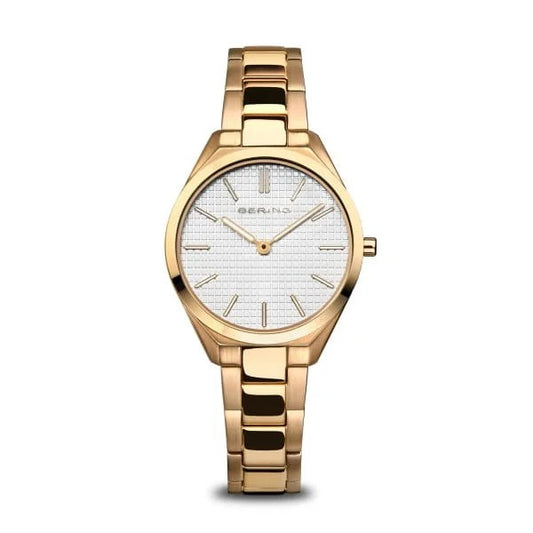 The Bering Watch - Ultra Slim Womens Gold (17231-734) features Danish design, a sleek linked metal band, and a round white textured face with gold markers and hands. The Bering name is below the 12 oclock position.