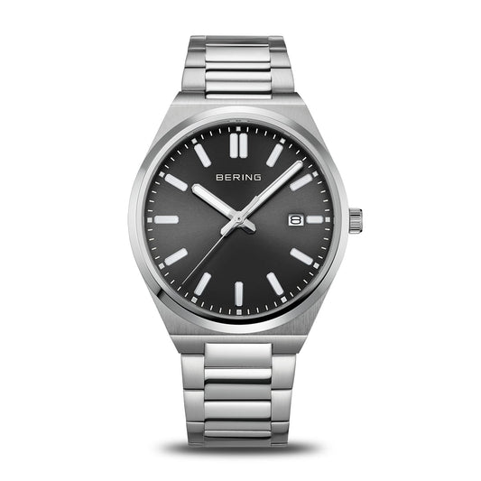 The Bering Watch - Polished Silver - 17639-702 features minimalist Danish design with a black dial, silver hour markers and hands, date window at 3 o’clock, and stainless steel link band, displayed against a white background.