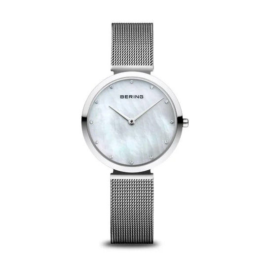 The Bering Watch - Classic Collection Womens Silver Mother of Pearl 18132-004 features a mesh band, round mother-of-pearl dial, and minimal hour markers for timeless elegance.