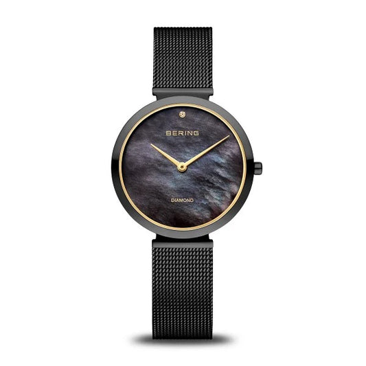 The Bering Womens Classic Collection Polished Black Watch (18132-132) features a minimalist design with a black mesh band, black and gold round case, dark iridescent face, gold hands, and a diamond at 6 o’clock.