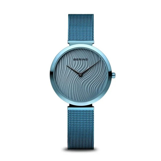 The Bering Watch - Womens Time to Care Collection 18132-Charity2 features an arctic-blue stainless steel mesh band, matching case, wavy-patterned dial, minimalist black hands, and the BERING logo at the top.