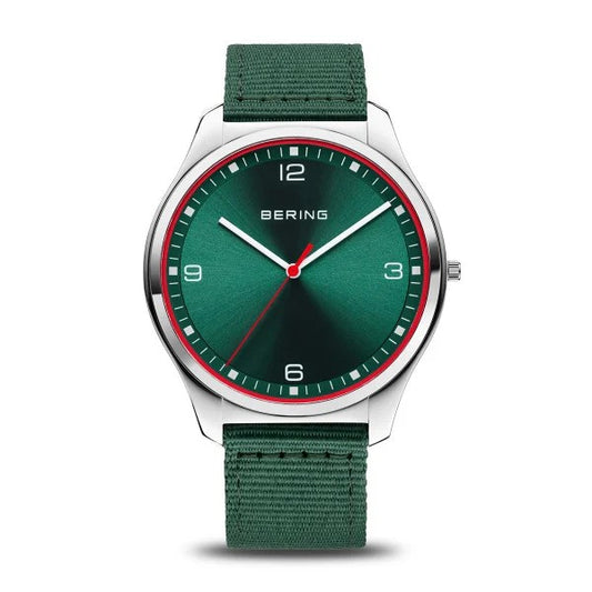 The Bering Watch - Ultra Slim Mens Green (18342-508) by Bering features Danish design, a green face with white hour markers, red details, a silver case, and a green fabric strap. The display shows the time at about 1:50:35.