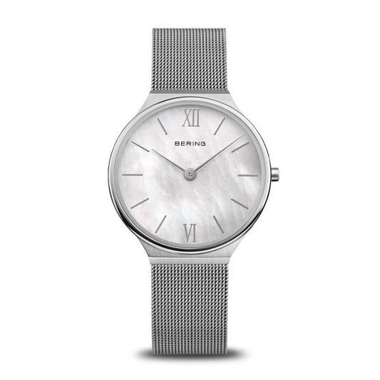 The Bering Ultra Slim Womens Watch (18434-000) features a silver mesh band, minimalist Danish design, mother of pearl dial in grey, and elegant silver hour markers with Roman numerals at 12 and 6.