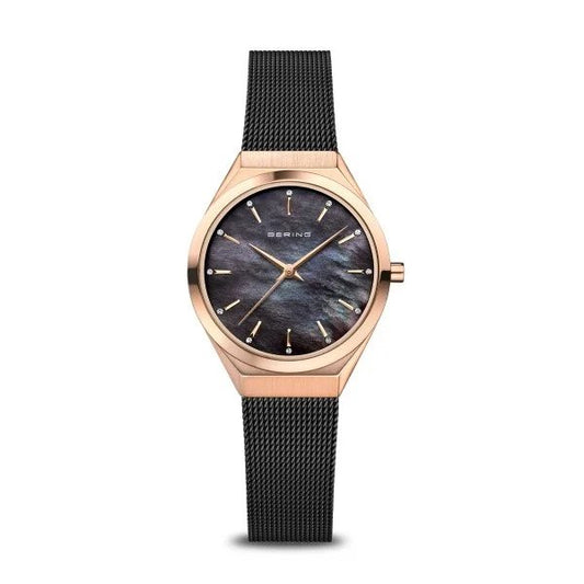The Bering Watch - Classic Ultra Slim Womens Rose Gold w/Black Mother of Pearl (18729-166) features a black mesh band, rose gold case, black mother-of-pearl dial, and gold markers with the Bering brand displayed on the dial.