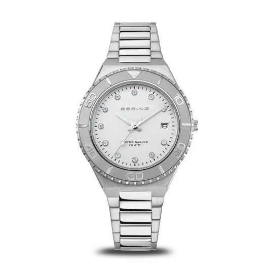 The Bering Watch - Womens Classic Collection - 18936-707 features a sleek metal band, white dial, silver markers, date at 3 o’clock, and Arctic Sailing 10 ATM—an elegant Bering watch for any occasion.