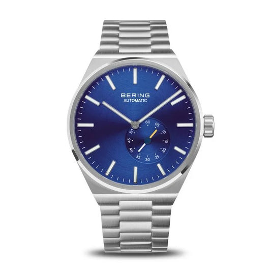 The Bering Watch - Mens Automatic with Blue Dial (19441-707) features a striking blue dial, silver hour markers, and a 6 o’clock subdial on a metal link bracelet, showcasing Bering’s signature blend of elegance and precision.