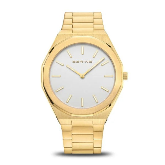 The Bering Watch - Classic Collection Mens Gold (19641-730) features a white dial, gold hour markers, and a gold metal link band, showcasing minimalist Danish design by Bering against a plain white background.