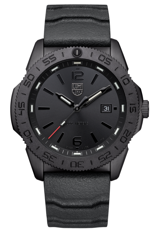 The Luminox Pacific Diver XS.3121.BO is a black Swiss Made wristwatch with a textured band, black dial, minimal markings, white date at 3 o’clock, red-tipped second hand, and rugged bezel. Photographed on a light background.