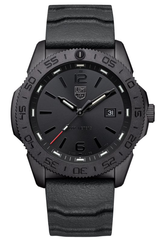 The Luminox Pacific Diver XS.3121.BO is a black Swiss Made wristwatch with a textured band, black dial, minimal markings, white date at 3 o’clock, red-tipped second hand, and rugged bezel. Photographed on a light background.