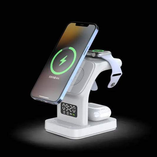 The Tech Trendz 5 in 1 Wireless Charger (1495-WH) by Tech Trendz, in white, holds a smartphone, smartwatch, and earbuds with a digital clock display on the front, all set against a black background.