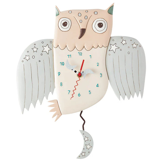 The Enesco Allen Designs Clock - Sweet Dreams Owl Clock (6015361) features an owl shape with light blue wings, star accents, a crescent moon pendulum, teal numbers, and red hands.