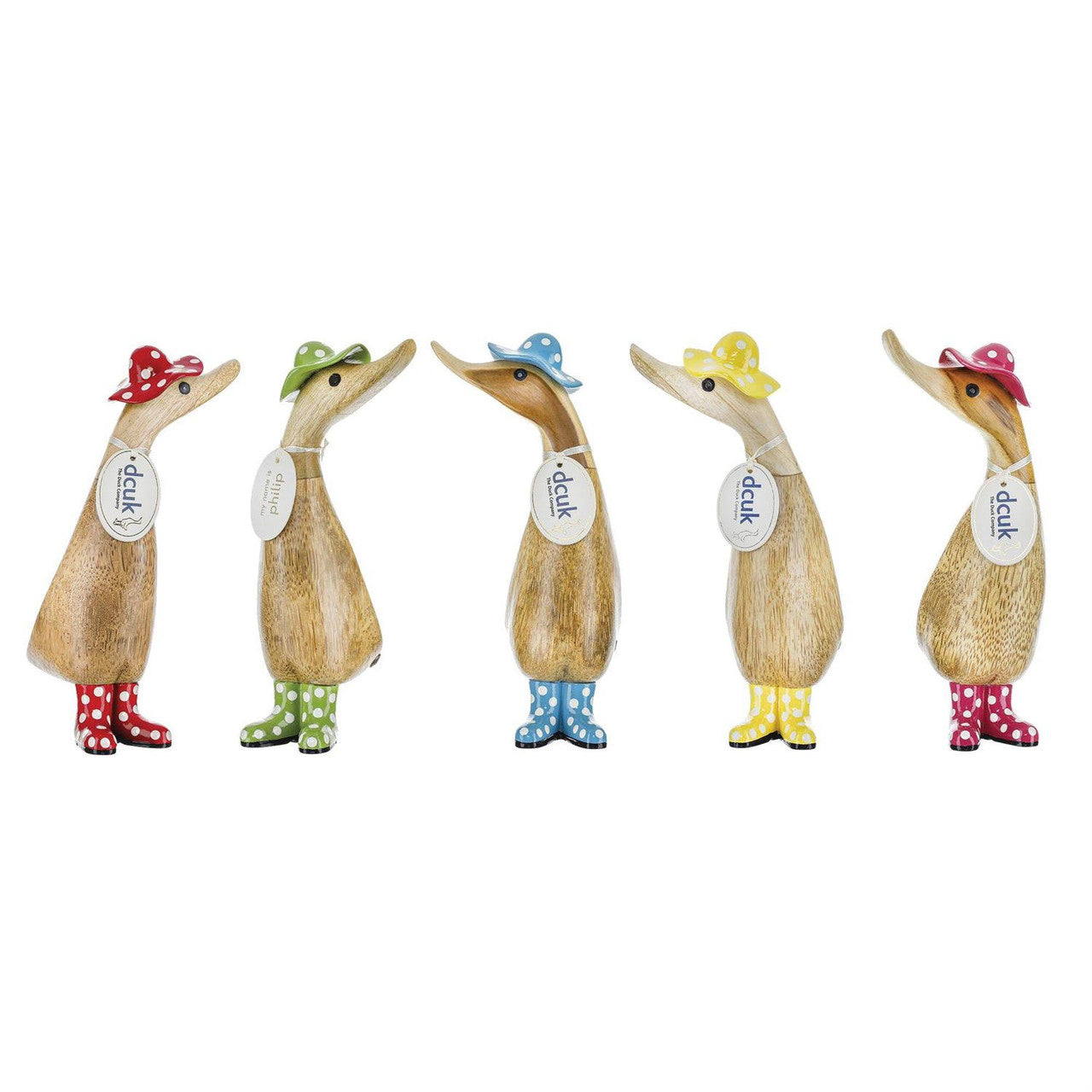 Five Enesco DCUK Ducks - Spotty Hat & Boots Ducklings (6017105) stand in a row, each hand-carved duckling wearing a colorful spotty hat and matching polka-dotted rain boots in red, green, blue, yellow, or pink with a dcuk tag around its neck.