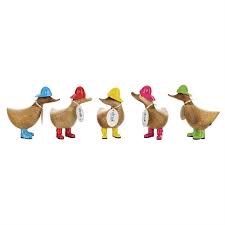 Five Enesco DCUK Ducks - Rainy Day Duckys (6017118), crafted from bamboo root, stand in a row wearing colorful rain boots and matching hats in blue, red, yellow, pink, and green.