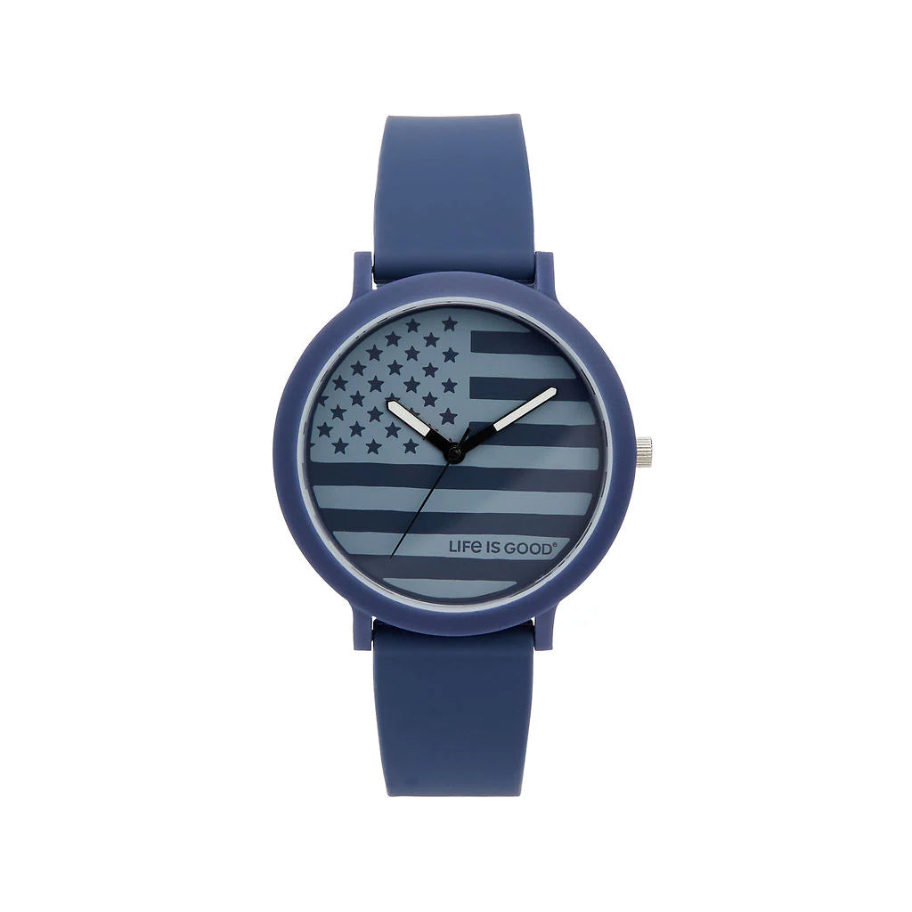 The Speidel Watch - Life is Good - American Flag (60930012) features an American flag design on the face with “LIFE IS GOOD” text at the bottom, by Speidel, shown against a white background.