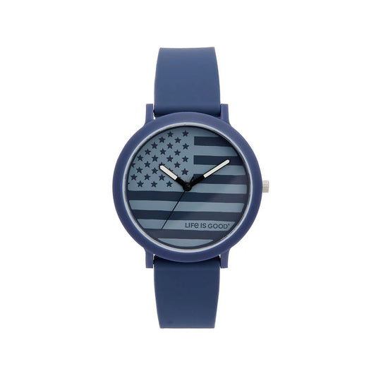 The Speidel Watch - Life is Good - American Flag (60930012) features an American flag design on the face with “LIFE IS GOOD” text at the bottom, by Speidel, shown against a white background.