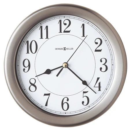 The Howard Miller Aries Wall Clock (625-283) features a brushed nickel frame, black numbers and hands, a gold second hand, quartz movement, and displays 8:07:23. The Howard Miller brand appears at the top of the clock face.