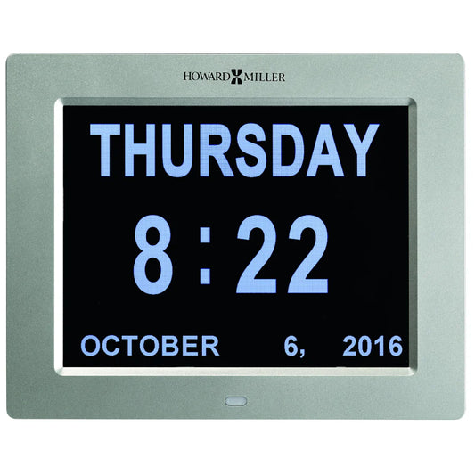 The Howard Miller Memory Clock 625-632 is a dementia clock with a large, easy-to-read display showing THURSDAY, 8:22, and OCTOBER 6, 2016, all in a sleek silver frame from Howard Miller.