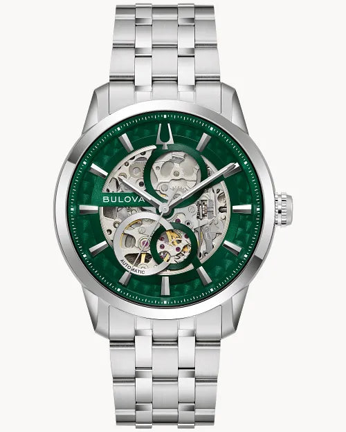 The Bulova Sutton 96A329 men’s watch features a silver metallic band, green dial, and an exposed skeleton movement that reveals its intricate inner workings.
