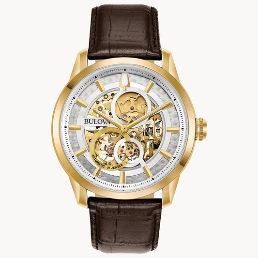 The Bulova Sutton 97A138 is a gold-tone skeleton watch with automatic movement, brown leather strap, see-through dial showing exposed gears, and gold hour markers set on a white ring.