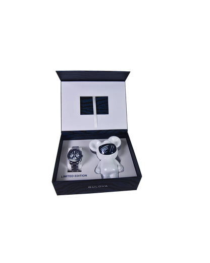 The Bulova Lunar Pilot Timascus 98A329 limited-edition chronograph gift set includes a wristwatch and a white bear figurine, both showcased in an open box with “LIMITED EDITION” displayed inside.