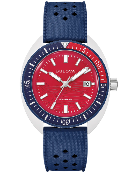 The Bulova Watch - Snorkel July 4th - 98B474 features a red dial, white hour markers, date window at 3 o’clock, blue bezel, and perforated blue textured strap.