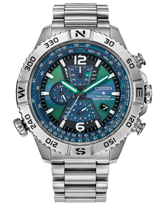 The Citizen Promaster Navihawk A-T (AT8220-55W) is a silver wristwatch with a metallic band, blue and green face, multiple subdials, compass bezel, and atomic timekeeping.