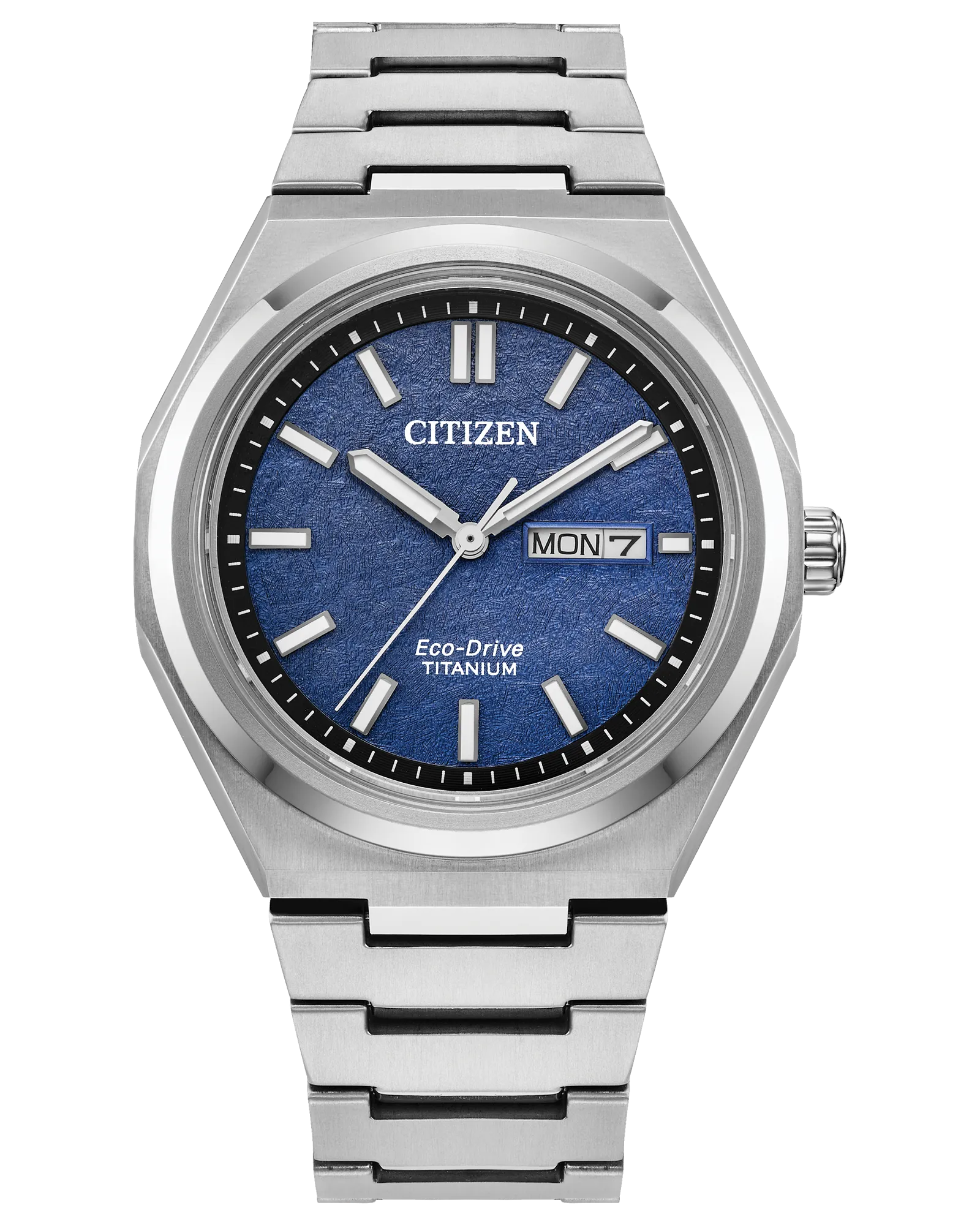 The Citizen Zenshin Super Titanium AW0130-85L features Eco-Drive, a silver band, blue textured dial, white markers and hands, and a day-date display at 3 o’clock.