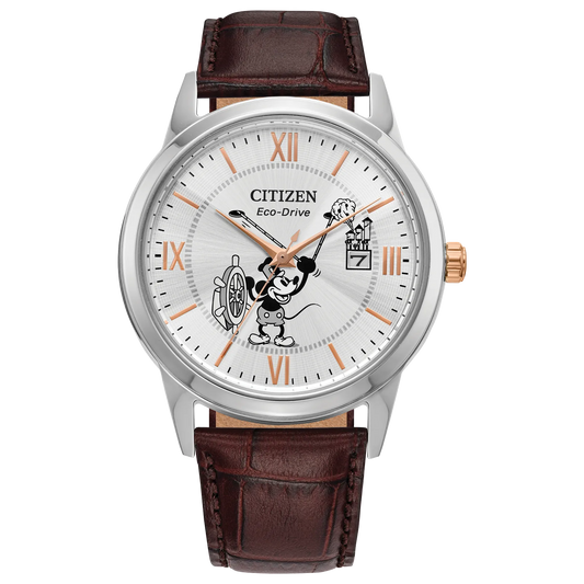 The Citizen Watch - Mickey Mouse Eco (AW1788-07W) by Citizen features a brown leather strap, silver case, and dial with Steamboat Willie 1928's Mickey Mouse at the helm, plus gold Roman numeral markers for a charming Disney touch.