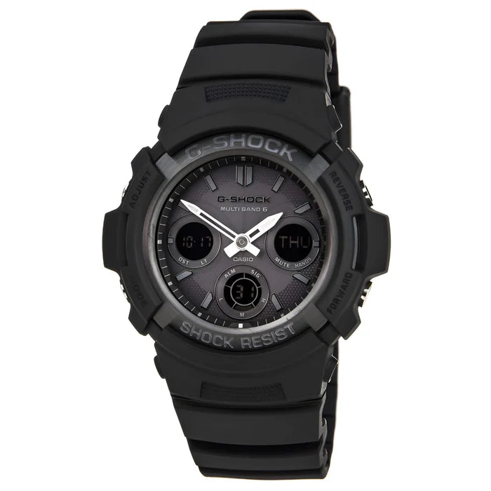 The VLC Distribution Co. G-Shock Watch - Atomic - AWGM100B-1A features a black resin band, round face with digital and analog displays, tough solar power, and shows day, date, time. Shock Resist and G-Shock are labeled on the bezel.