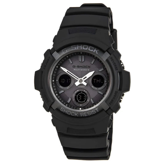 The VLC Distribution Co. G-Shock Watch - Atomic - AWGM100B-1A features a black resin band, round face with digital and analog displays, tough solar power, and shows day, date, time. Shock Resist and G-Shock are labeled on the bezel.