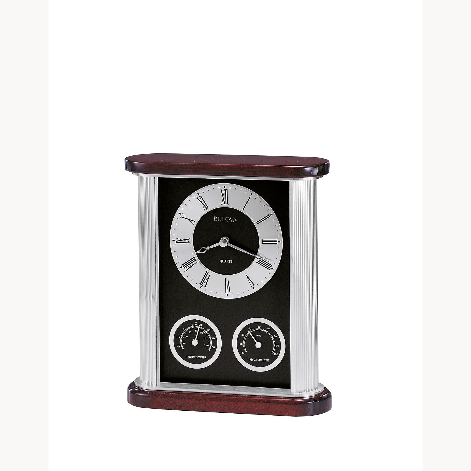 The Bulova Clock Belvedere B7590 is a rectangular timepiece with a classic round face, Roman numerals, dual temperature and humidity dials, and a black and silver case accented with rich mahogany.