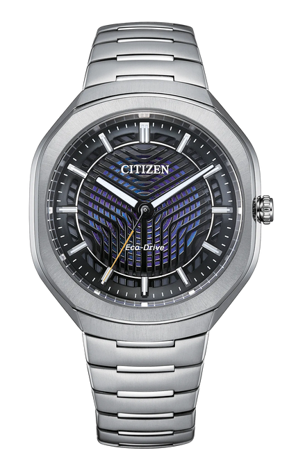 The Citizen Watch - Limited Edition Photon (BJ6560-53W) by Citizen features a silver metal bracelet and round case, showcasing modern elegance with its geometric blue and black dial, silver hour markers, and date window. Powered by advanced Eco-Drive technology, this limited edition timepiece combines innovative function with striking design.