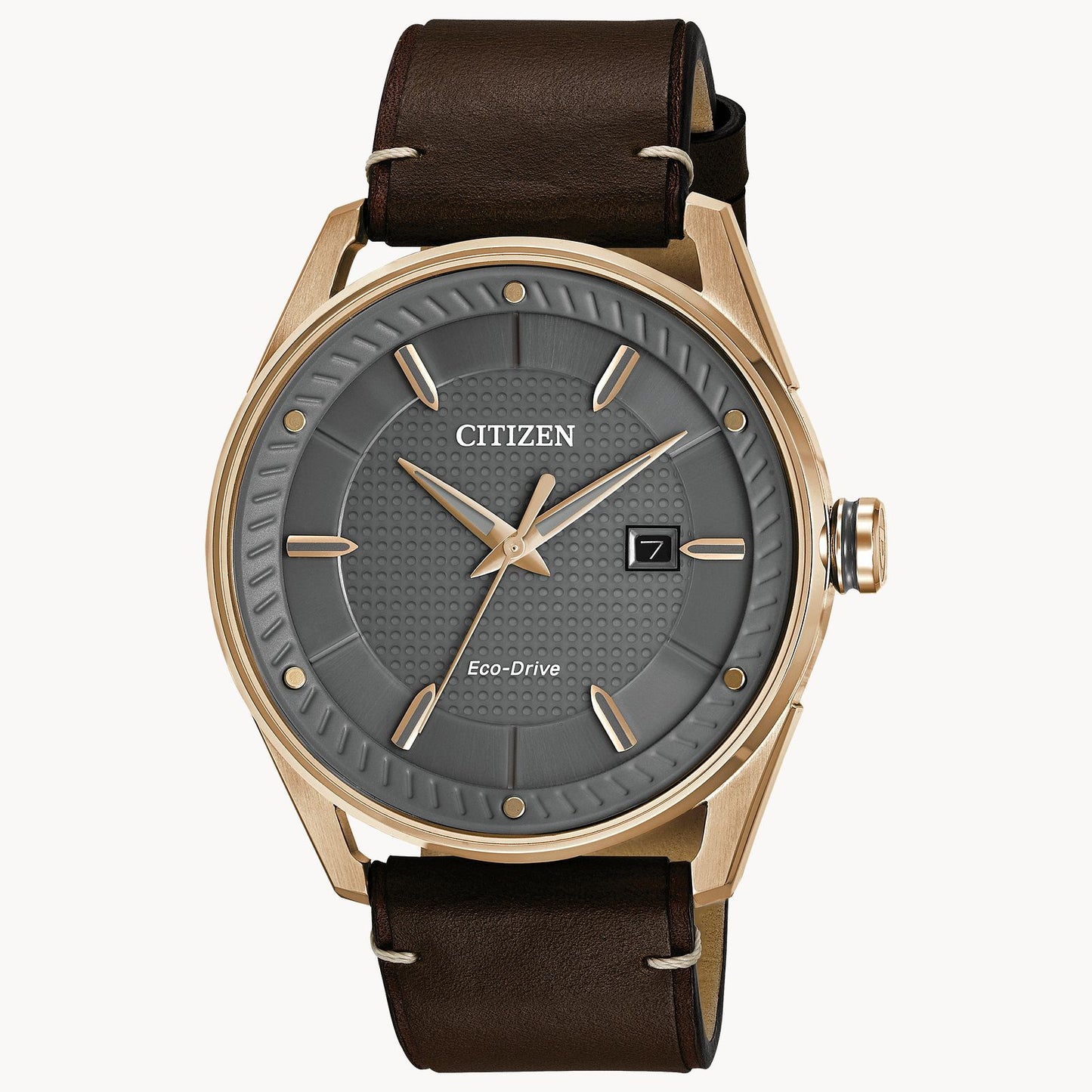The Citizen Watch - Sport Casual BM6983-00H by Citizen features a brown leather strap, rose gold-tone stainless steel case, and a grey textured dial with gold accents and date window at 3—combining style and function.