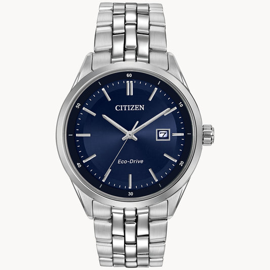 The Citizen Watch - Addysen (BM7251-53L) is a silver men's Eco-Drive watch featuring a stainless steel band, blue dial, silver hour markers, and date display at 3 o'clock, with CITIZEN and Eco-Drive branding on the face.
