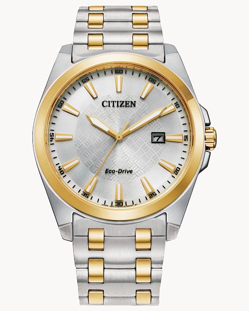 The Citizen Watch - Peyten - BM7534-59a features a two-tone silver and gold stainless steel band, a white patterned dial with gold hour markers, date display at 3 o’clock, and shows the time as 7:00.