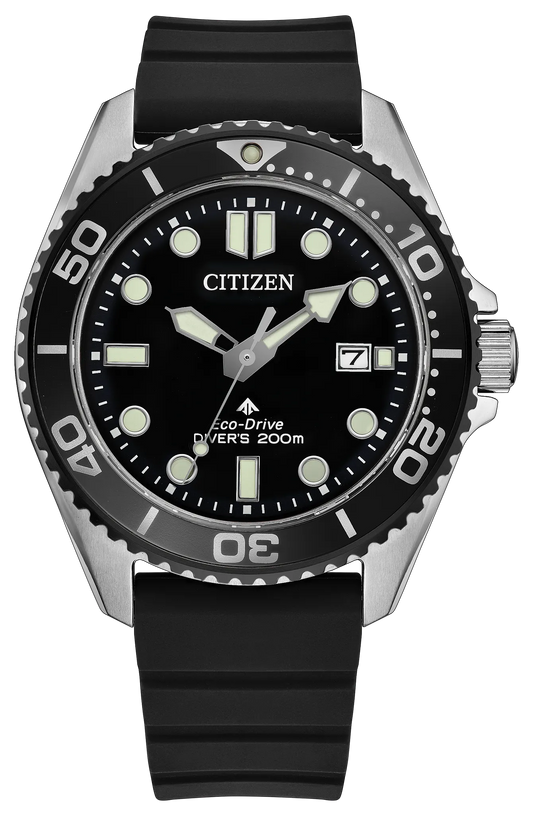 Introducing the Citizen Watch - Promaster Dive - BN0266-07E by Citizen, a rugged dive watch powered by reliable Eco-Drive technology. This timepiece features a striking black dial with luminous markers, a date display at 3 o’clock, a black bezel, and a robust silver case complemented by a durable black rubber strap. Water-resistant up to 200 meters, it’s designed for adventure both above and below the waves.