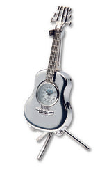 The Sanis Enterprises Sanis Mini Clock - Guitar Acoustic Silver (C254SIL) is a stylish mini clock shaped like a silver acoustic guitar, featuring a clock face in the guitars body and standing upright on a tripod stand.