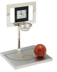The Sanis Enterprises Sanis Mini Clock - Basketball Silver (C438SIL) features a basketball-inspired design with a clock face in the backboard, metal net, orange basketball, and sleek silver base styled as a mini court.
