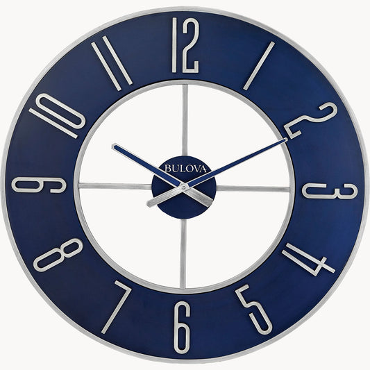 The Bulova Clock - Blue Steel (C4809) features a steel blue dial, silver frame, large silver numbers, and open-center design. Silver hands set to 10:10 and the white Bulova logo at center add a sleek modern touch to any room.
