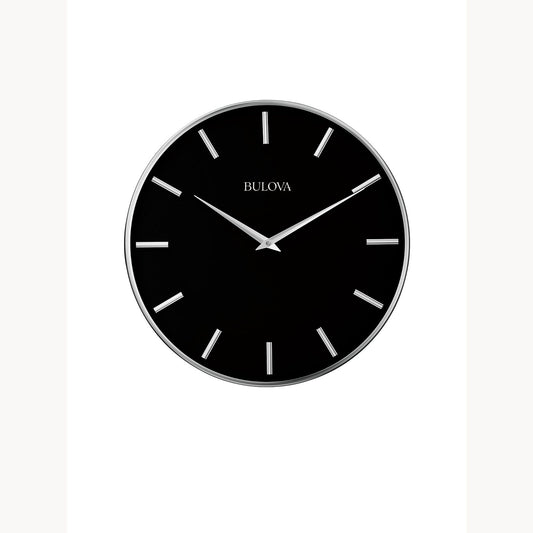 The Bulova Clock - Metro - C4849 features a round metal case, black face, silver hands, and silver hour markers. This contemporary wall clock by Bulova displays 10:09 against a plain white background.