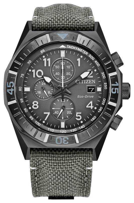 Introducing the Citizen Watch - Nighthawk Chrono (CA0897-04H) by Citizen, this men's sports watch showcases a bold black dial with gray numerals, three subdials, a date display, and a black bezel. The bezel features tachymeter markings and is accented in blue at the 12, 3, 6, and 9 o'clock positions. A textured gray fabric strap completes its dynamic look.