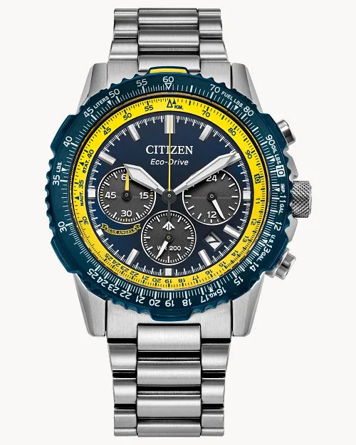 The Citizen Promaster Navihawk (CA4667-53L) is a silver Eco-Drive aviation chronograph featuring a stainless steel band, blue dial with yellow accents, three subdials, and detailed minute/second markers for precise timekeeping.