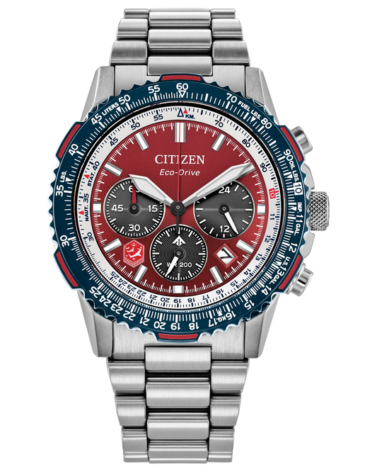 The Citizen Snowbirds Promaster Navihawk (CA4668-51X) is a stainless steel chronograph with a red dial, blue bezel, silver hour markers, date window, multiple subdials, and metal bracelet, inspired by the Royal Canadian Air Force.